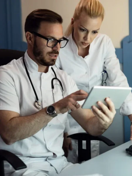 male-doctor-nurse-cooperating-while-examining-electronic-medical-records-patient-doctor-s-office-1024x683